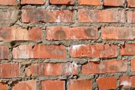 How does cement stick bricks together?