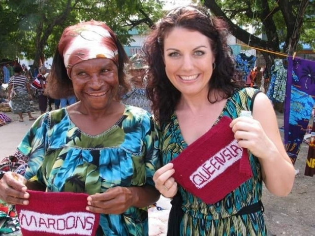 Dr Rochelle Stewart Withers with pop up local vendor selling rugby league State of Origin handmade merchandise Port Morseby PNG Dr Rochelle Stewart Withers with pop up local vendor selling rugby league State of Origin handmade merchandise Port Morseby PNG