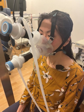 Macrae swallowing Dr Karen Ng (Postdoctoral fellow based at the Rose Centre) with a respiratory-swallowing coordination mask on, as part of Dr Phoebe Macrae's research. Photo: Supplied.