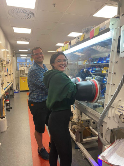 Mat Anker (left) and PhD student Tylah Sweet (right) using a drybox in the lab. Photo: Supplied.