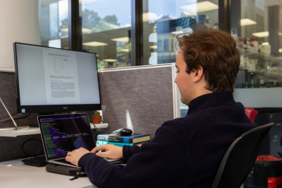 Sitting at a computer desk station