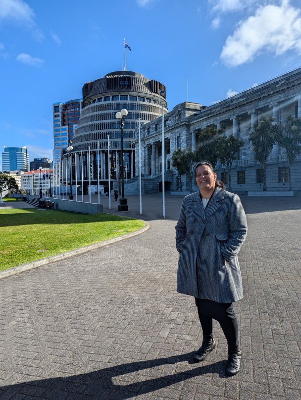 Dr Pauline Harris in front of Parliament Dr Pauline Harris, in a winter coat, stands in front of the Beehive and houses of Parliament