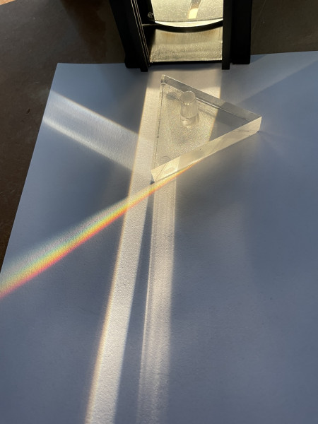 A rainbow that is emitted when white light is shone through a prism.